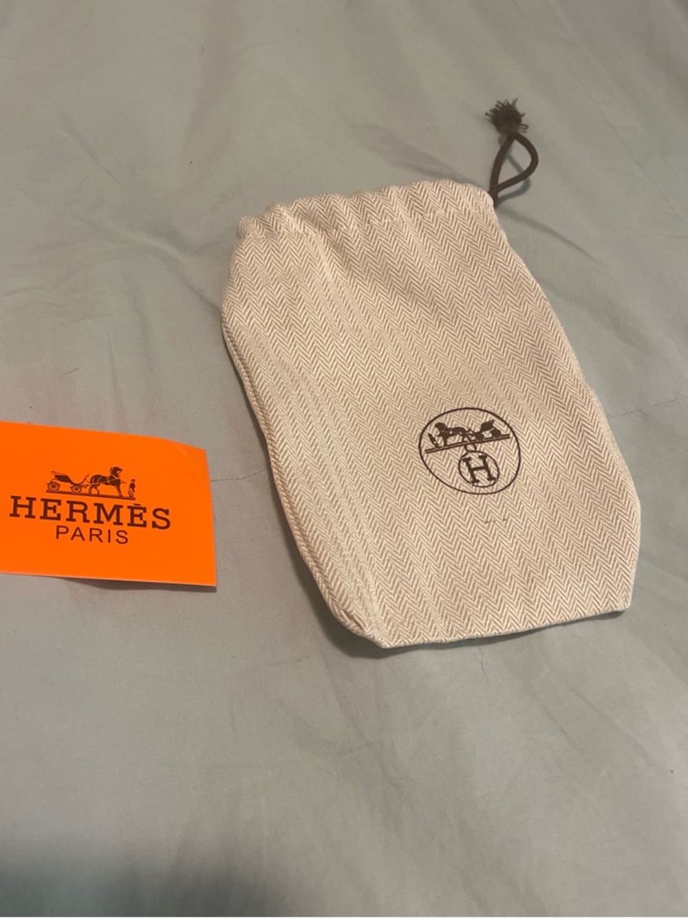 Beige Drawstring Dust Bag – Luxury Accessories Pouch and tag